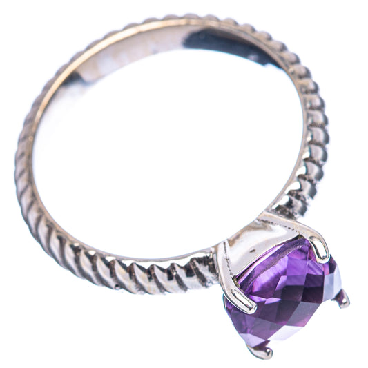 Amethyst ring with twisted sterling silver band and prong-set purple cushion-cut stone detail