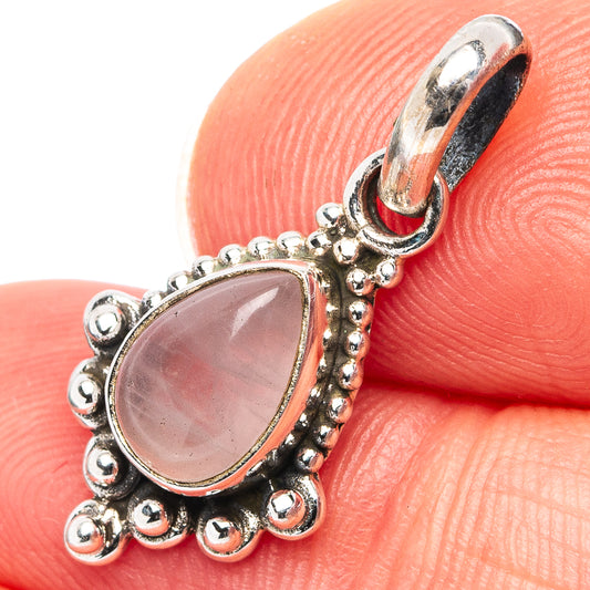 Sterling silver rose quartz pendant with teardrop pink stone and ornate bead setting