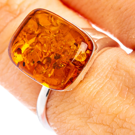 Adjustable sterling silver ring with square faceted Baltic amber cabochon