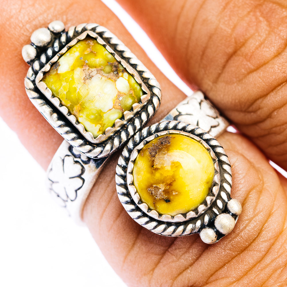 Sterling silver ring with yellow oval gemstone set in ornate beaded border