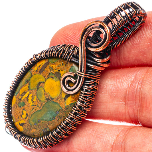 Oxidized copper wire-wrapped jasper pendant with oval stone and loop bail
