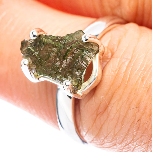 Sterling silver ring with rough green moldavite stone and four prong bezel setting