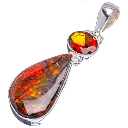 Sterling silver ammolite teardrop pendant with faceted red gemstone drop