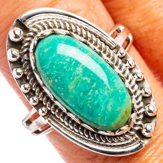 Oval turquoise cabochon sterling silver ring with ornate rope and bead border