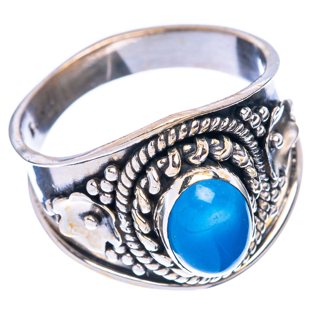 Sterling silver ring featuring oval blue gemstone cabochon and braided filigree band