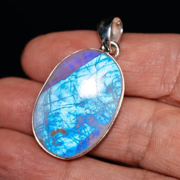 Oval .925 sterling silver moonstone pendant with bright blue rainbow sheen