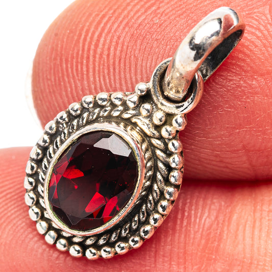 Sterling silver garnet pendant with oval red gemstone, beaded halo and bail