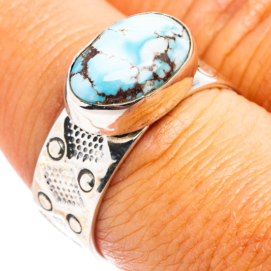 Sterling silver turquoise oval ring with engraved band and blue gemstone cabochon