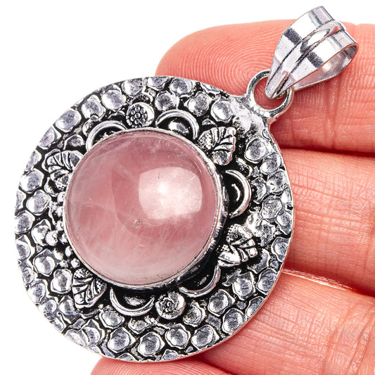Rose quartz pendant, German silver round ornate frame with pink cabochon and bail