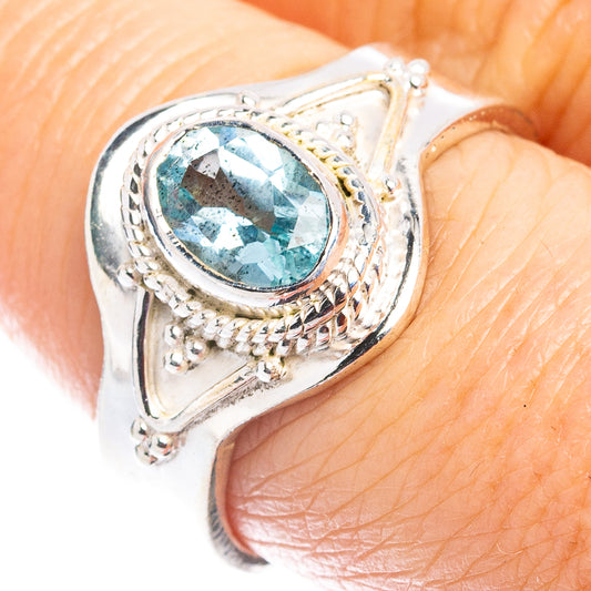 Sterling silver ring with oval blue topaz gemstone and ornate filigree bezel, size 7