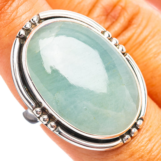 Oval aquamarine gemstone sterling silver ring with raised bezel and beaded edge