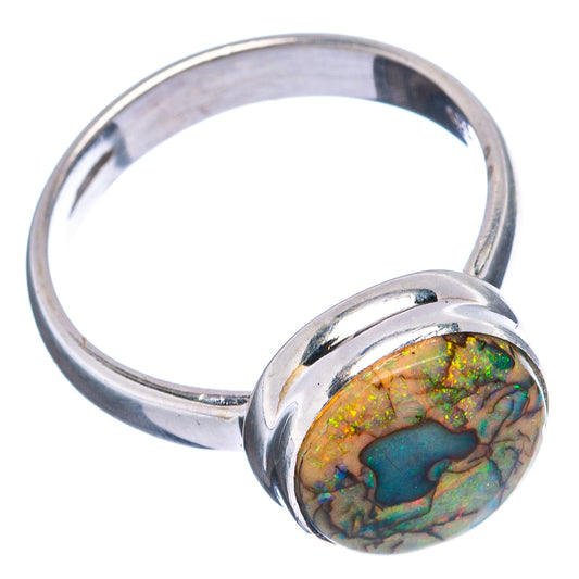 Sterling silver opal cabochon ring with round multicolor green-orange stone, side view