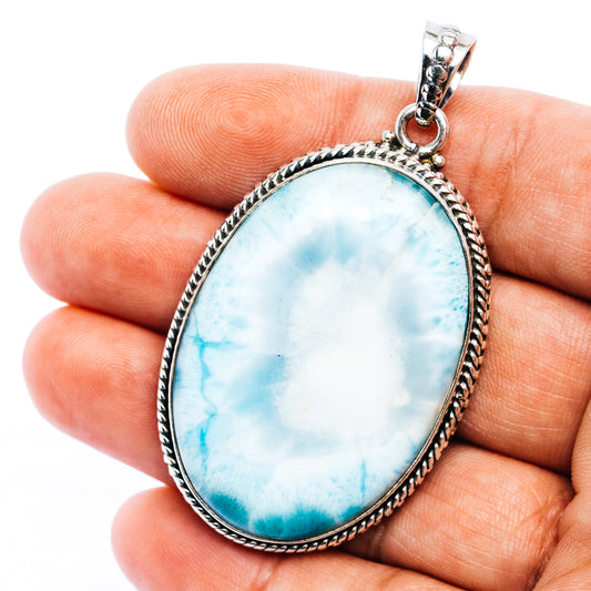 Oval Larimar stone pendant in .925 sterling silver bezel with loop bail