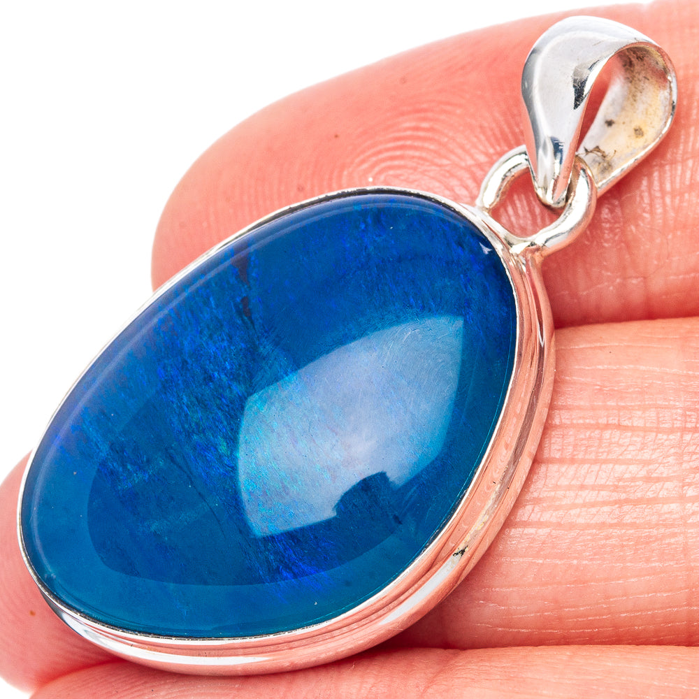 Oval blue opal pendant in 925 sterling silver bezel with loop bail