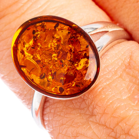 Amber oval cabochon ring with .925 sterling silver band, adjustable