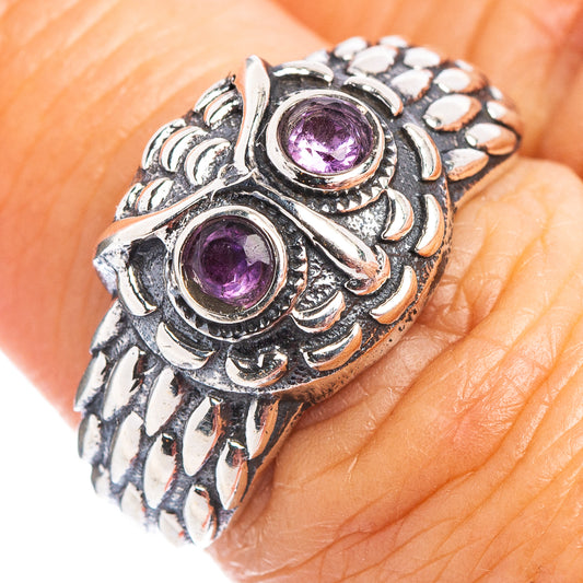 Sterling silver owl dainty ring close-up, two amethyst purple set stones and carved details