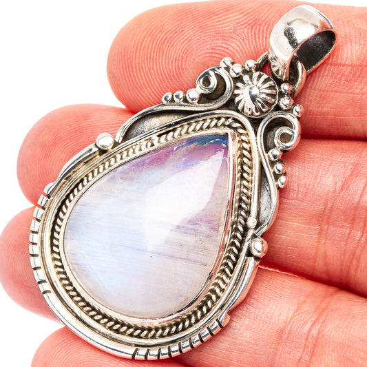 Ornate teardrop moonstone pendant in .925 sterling silver, rainbow iridescent center