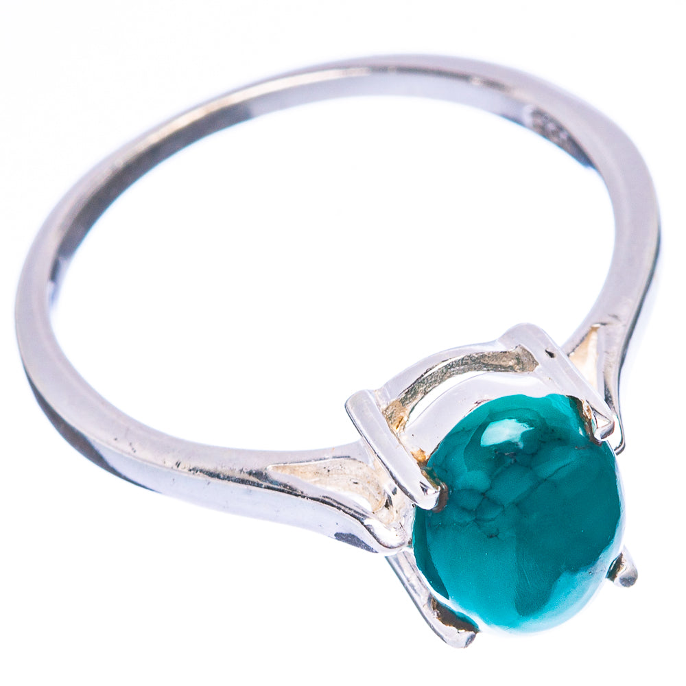 Sterling silver ring with turquoise oval stone on open metal band, side view
