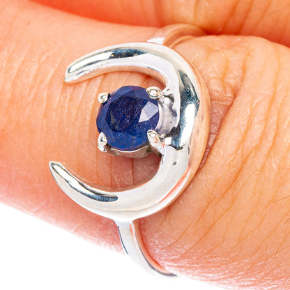 Sterling silver moon ring with dark blue oval gemstone and prong settings