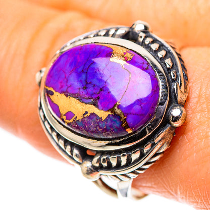 Sterling silver ring with oval purple turquoise cabochon, gold matrix, ornate band