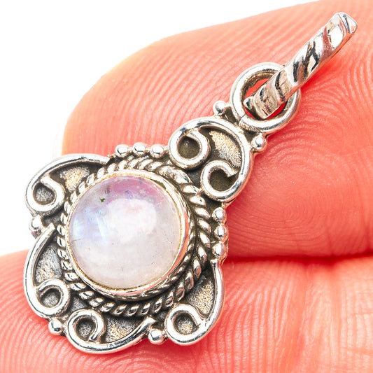 Sterling silver moonstone pendant with iridescent round cabochon and ornate bail