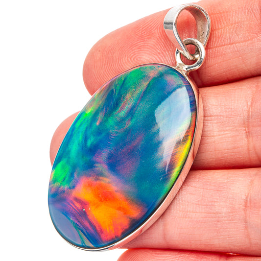Sterling silver opal pendant with oval iridescent blue-green stone, round bail