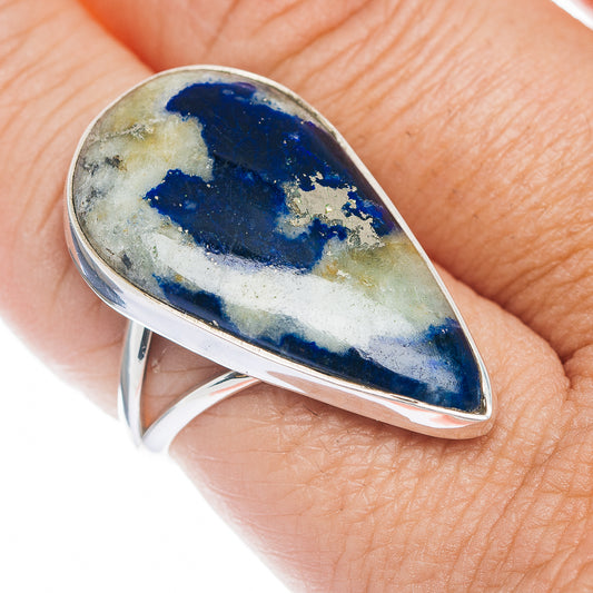 Sterling silver ring with oval blue-and-gold stone, slim side split shank