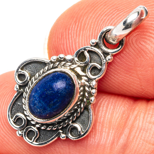 Lapis lazuli oval cabochon pendant in .925 sterling silver with ornate bail