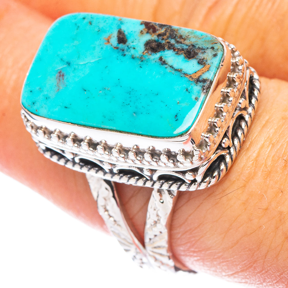 Oval turquoise cabochon sterling silver ring with ornate engraved side details