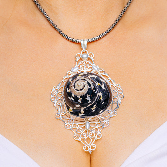 Sterling silver filigree pendant with cultured pearl shell centerpiece