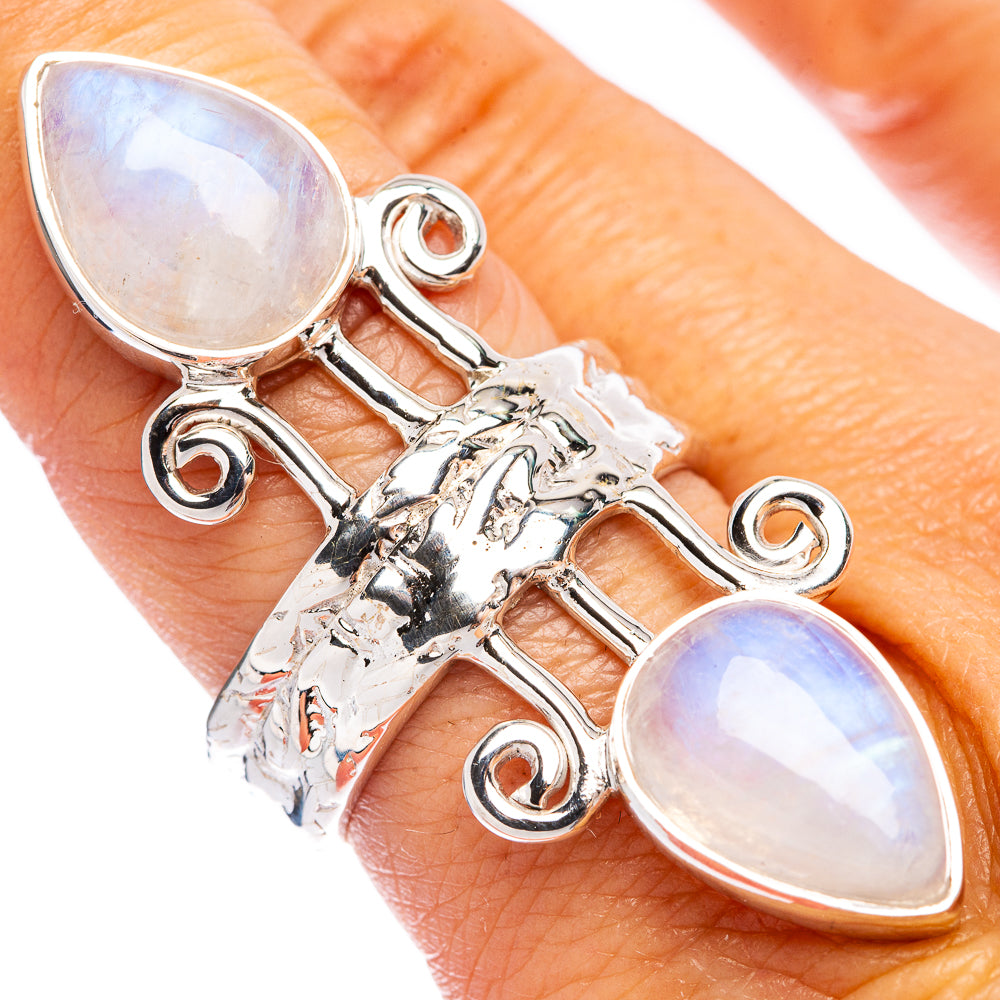 Sterling silver moonstone ring with three teardrop stones and rainbow iridescence