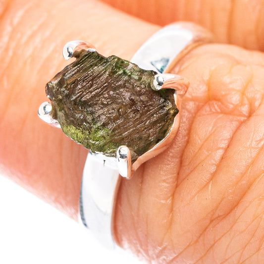 Sterling silver ring with rough green moldavite stone and four prongs