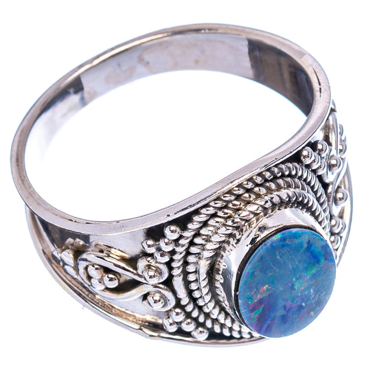Sterling silver opal doublet ring, side view with oval blue iridescent cabochon