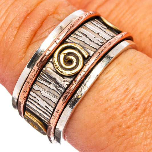 Spinner meditation ring in .925 sterling silver with gold spiral and copper trim