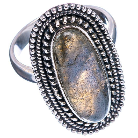 Oval labradorite cabochon sterling silver ring with raised beadwork border