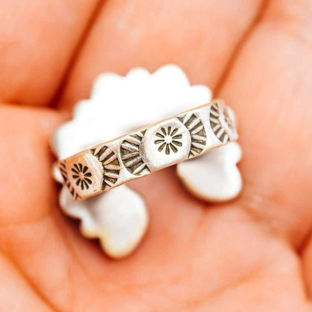 Ornate sterling silver ring band with engraved geometric and flowerburst details