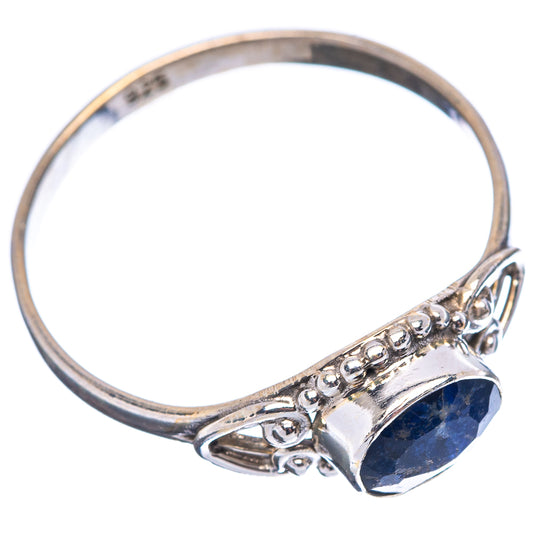 Sterling silver sodalite ring with oval blue stone and decorative side scrollwork