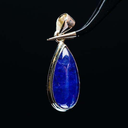 Pear-shaped tanzanite pendant with polished .925 sterling silver frame and bail detail.