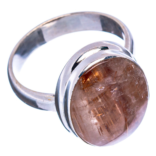 Sterling silver ring with oval rutilated quartz cabochon, warm gold and pink fibers