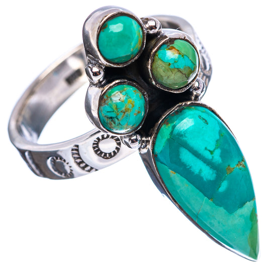 Sterling silver turquoise ring with three round stones and a large pear cabochon, side view