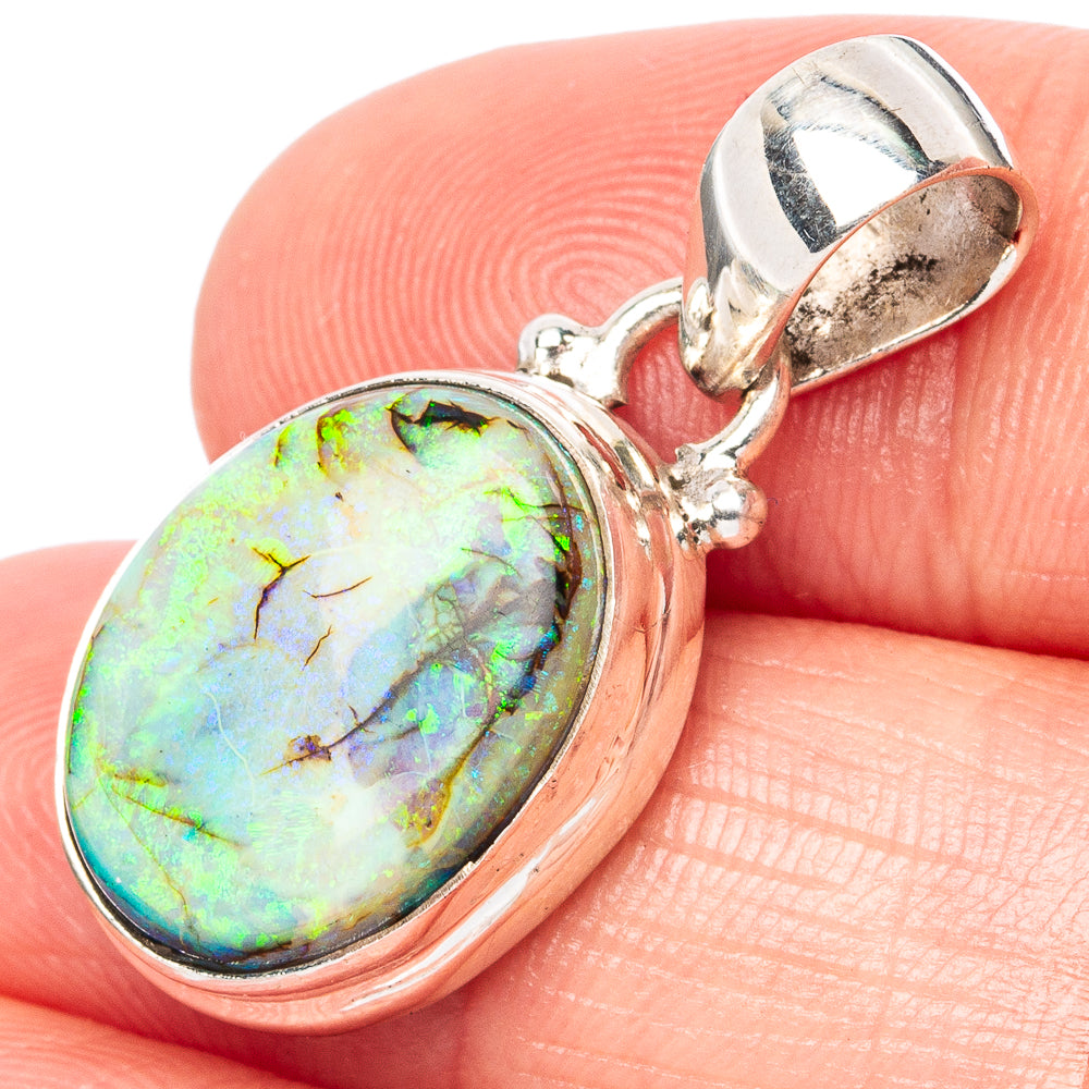 Sterling silver opal pendant with oval iridescent green-blue stone, split bail detail