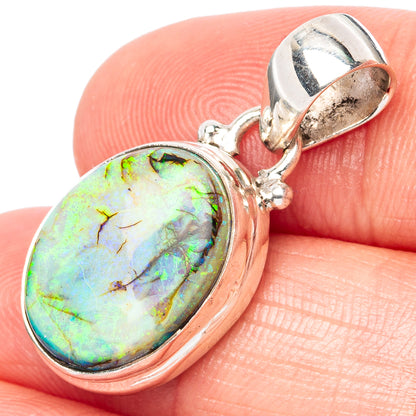 Sterling silver opal pendant with oval iridescent green-blue stone, split bail detail