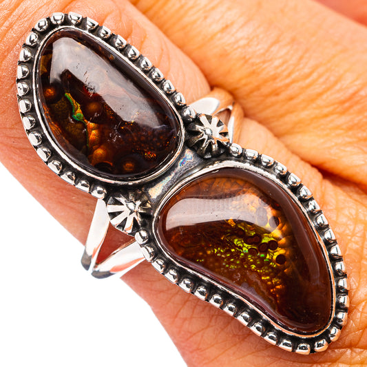 Sterling silver ring with two oval fire agate stones, beaded bezel and starburst accents.