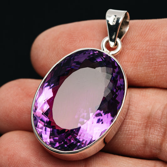 Oval faceted amethyst pendant in .925 sterling silver with round bail