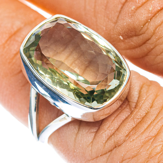 Sterling silver oval amethyst ring with faceted green stone, close-up on top
