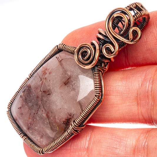 Oxidized copper wire-wrap pendant with oval rutilated quartz and dark accent at top