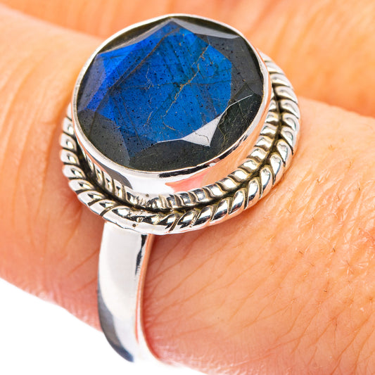 Sterling silver labradorite ring with faceted blue gemstone and carved braid band