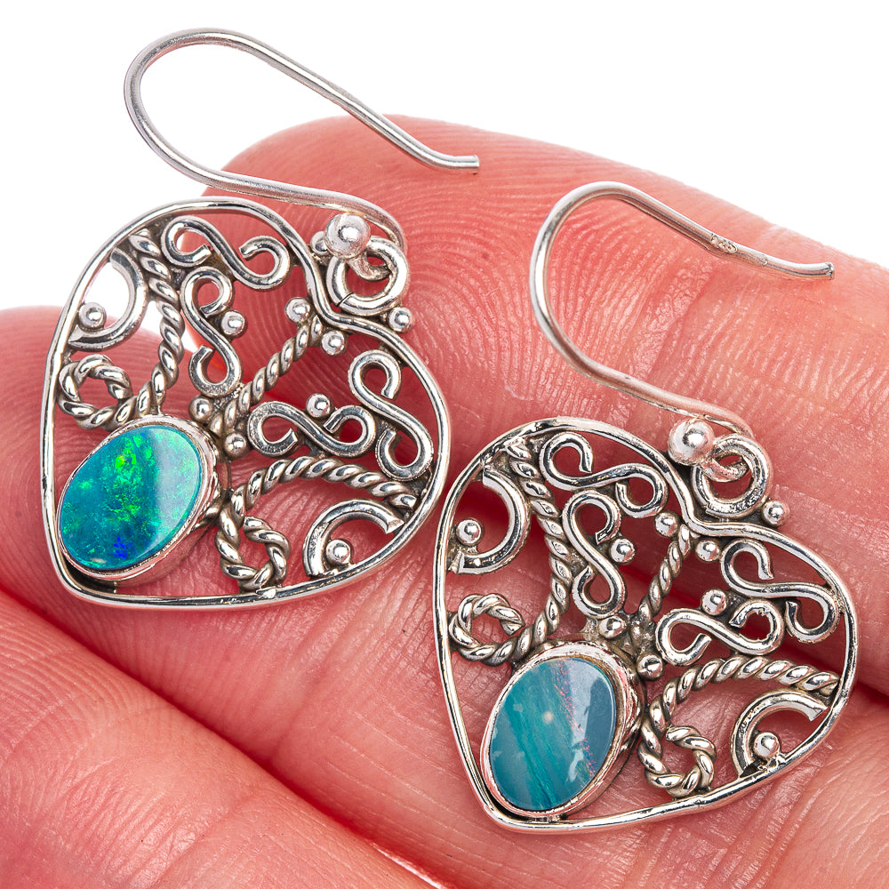 Sterling silver filigree heart earrings with blue-green opal cabochon