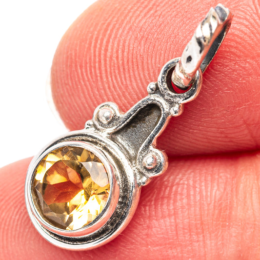 Sterling silver citrine pendant with round faceted yellow gemstone and loop bail