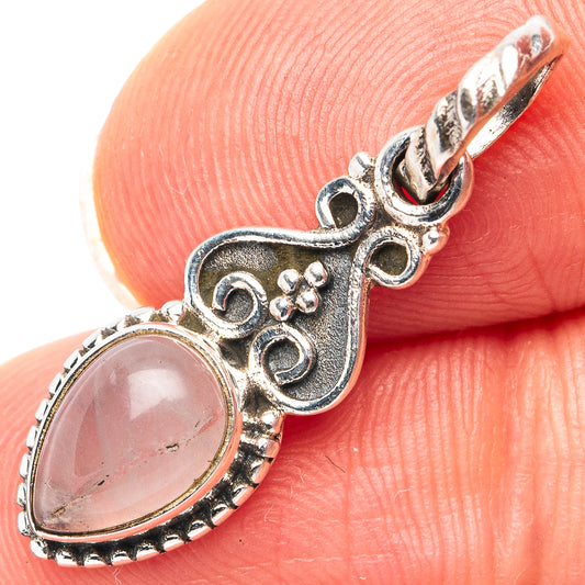 Rose quartz oval pendant in .925 sterling silver with ornate side scroll bail